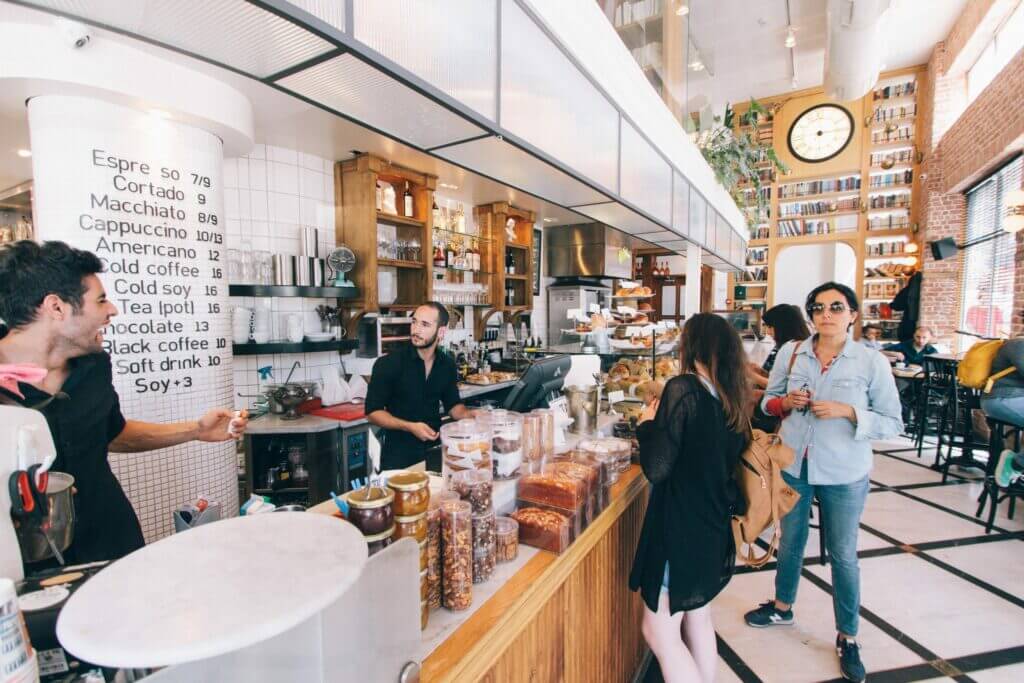 People ordering coffee from a local cafe